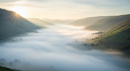 Fototapeta premium Sunrise Over Misty Mountain Valley: Breathtaking Landscape Photography