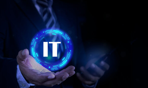 IT consultant presenting tag cloud about information technology. Tech icons illustration. Futuristic background. Businessman holding Icon IT.