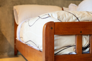 Wooden bed with mattress