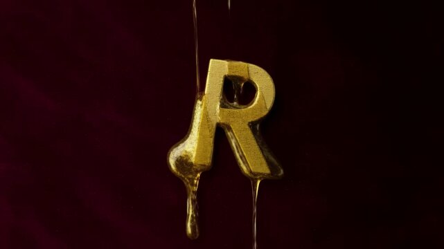 Elegant Golden Letter R With Liquid Gold Dripping Against A Rich Burgundy Background