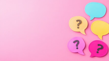 Colorful question mark speech bubbles on pink background