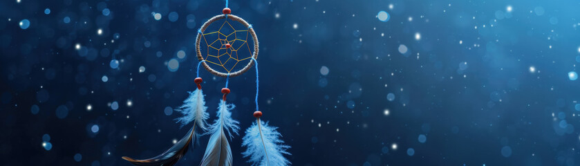 Dreamcatcher with feathers hanging under starry night sky with glowing bokeh lights