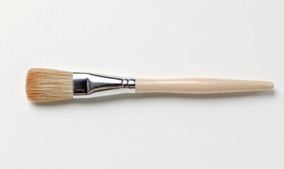 Fototapeta premium Paintbrush with a wooden handle and bristles, ideal for art and crafts.