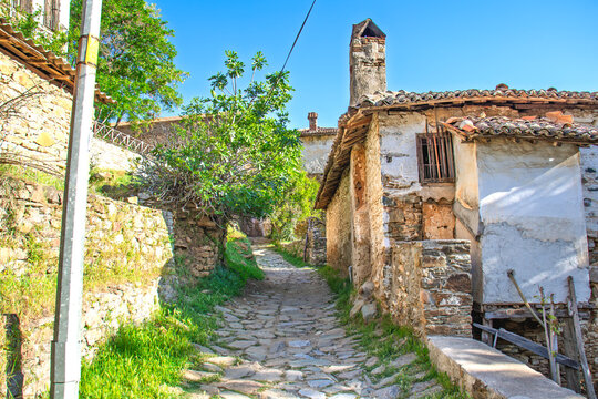 Fototapeta Traditional stone houses and narrow streets of Sirince. Historical architectural buildings. Sirince is an old Greek village and a popular tourist spot. Travel idea concept. 