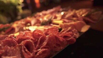 Close-up of gourmet Argentine charcuterie board with cured meats and cheese at elegant event