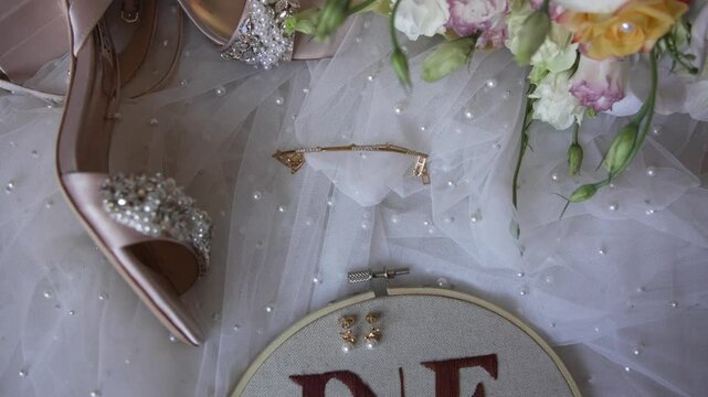 bridal accessories and flowers with embroidered initials on veil