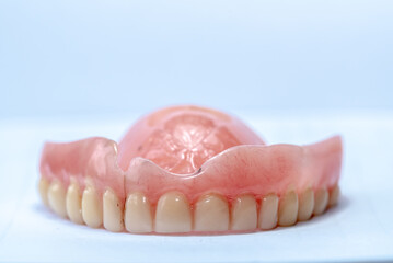 
Old denture on a white background.