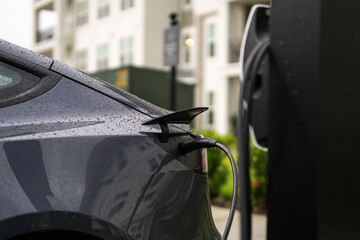 Electric car charging. Recharging service station. Green energy-powered charging station, electric...