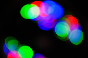 Blurred photo background. Brightly colored bokeh lights