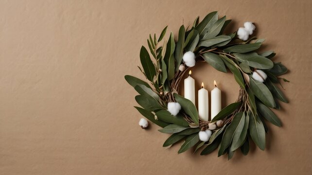 Embracing the warmth three Advent candles impart, nestled in green foliage and cotton against a neutral Taupe background