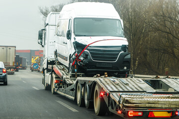 Logistics truck transporting crashed cargo van
