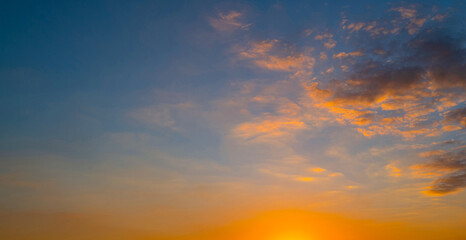 Sky on sunset. Beauty sunrise with sunlight background. Twilight, dramatic dawn, dusk, sunshine. Cloudy sunset. Sunset wallpaper. Sky sunset overlay. Peaceful horizon. Panorama of glow shiny sky.