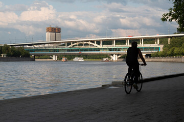 silhouette of a cyclist on narebezhnaya street