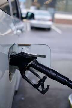Fuel pump nozzle at gas station