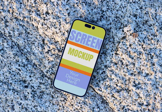 Mockup of a Blank Smartphone on Rocky Surface