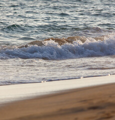The ocean is calm and the waves are small