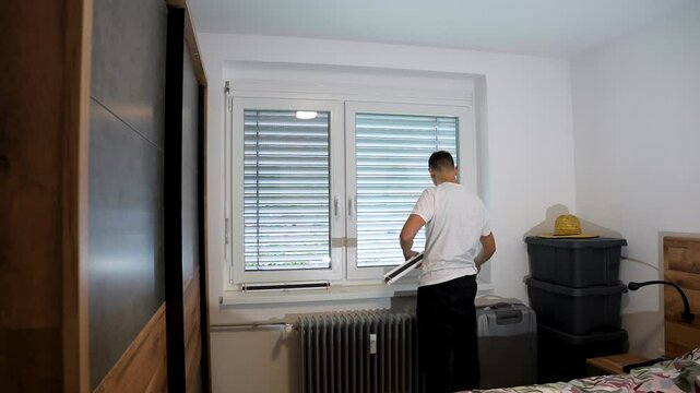 Timelapse of pleated window shade installation process