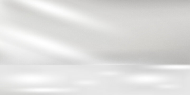 Minimal abstract light gray background for product presentation. Soft shadow and light from windows on white wall.