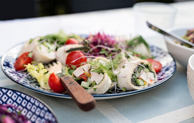 Healthy food for dinner or breakfast on plate ready to eat. Raw food rolls as a appetizer with...