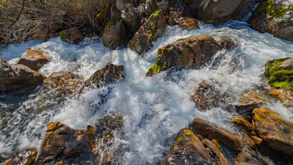 the river flows in a mountain gorge. © Aliaksei
