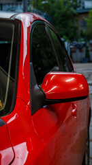 Red passenger car at the service station.