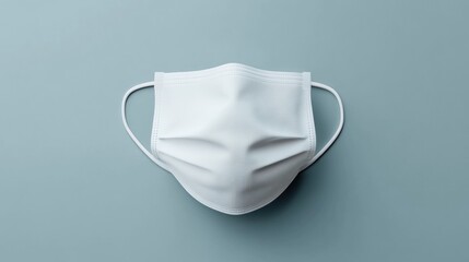 Single White Disposable Face Mask on Blue Background Hygiene Protection Health Safety
