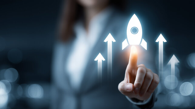 Startup Launch and Growth - A businesswoman activates a rocket icon to symbolize the launch of a new startup, rapid business growth and technological innovation