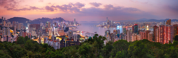 Hong Kong cityscape with skyscrapers at sunset, panorama