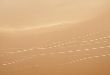Golden Sky Serenity: Delicate, luminous streaks gently curve across a warm, ethereal sky, creating a serene and minimalist composition that evokes a sense of peace and tranquility. Ai generated image