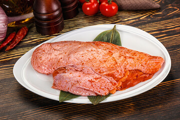 Raw marinated duck breast for cooking