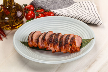 Sliced duck breast baked with cherry