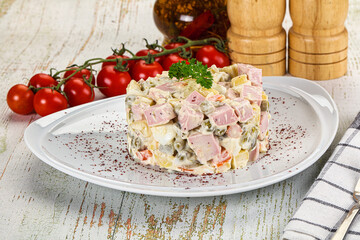 Russian traditional Olivier salad with sausages