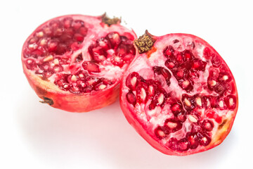 halved pomegranate isolated on white background