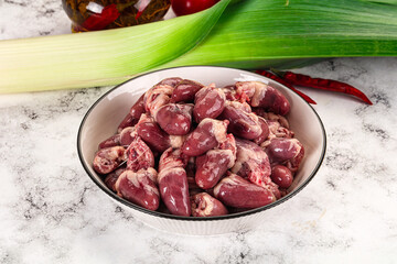 Raw chicken hearts in the bowl