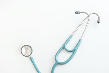 New stethoscope on white background, top view. Medical instrument