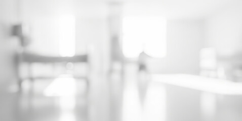 Blurred view of a bright white interior space possibly a hospital or clinic.