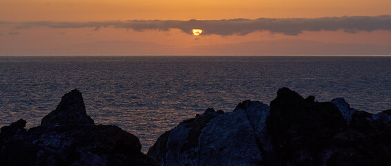 Atlantic sunset with volcanic coast