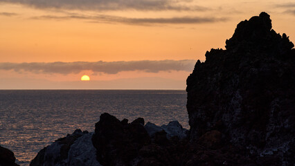 Atlantic sunset with volcanic coast