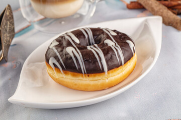 Delicous sweet donut with chocolate glaze