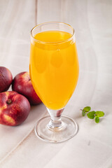 Vitamin beverage - peach juice glass