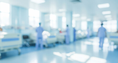 Fototapeta premium Blurred hospital ward with beds and medical staff in a bright setting.