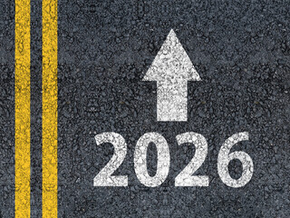happy new year 2026 Year 2026 and an arrow written on an asphalt road
