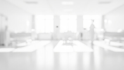 Blurred hospital room interior with beds and figure in the background.