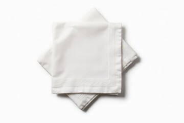 Fototapeta premium Kitchen towel isolated on white. Folded cloth.Food serving design element. Square napkin top view.