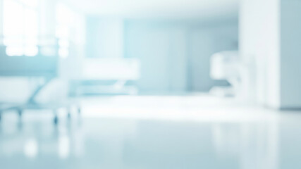 Blurred hospital room interior with bed and equipment in a bright setting.