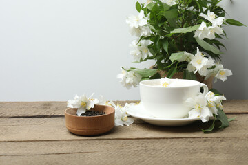 Organic Green Tea with Jasmine Flower and Jasmine Tea with Dried Leaves on tea cup