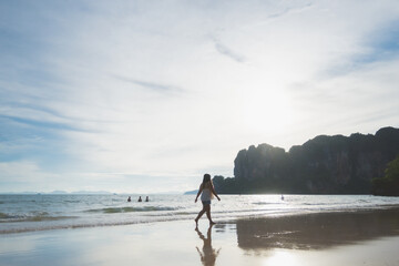 happy woman stand on the beach at krabi province, Thailand. soft focus