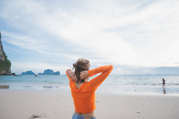 happy woman stand on the beach at krabi province, Thailand. soft focus