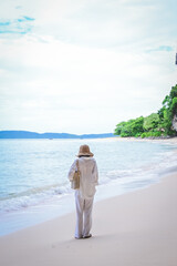 happy woman stand on the beach at krabi province, Thailand. soft focus