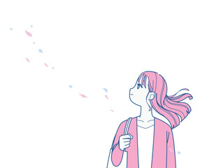 髪をなびかせる若い女性